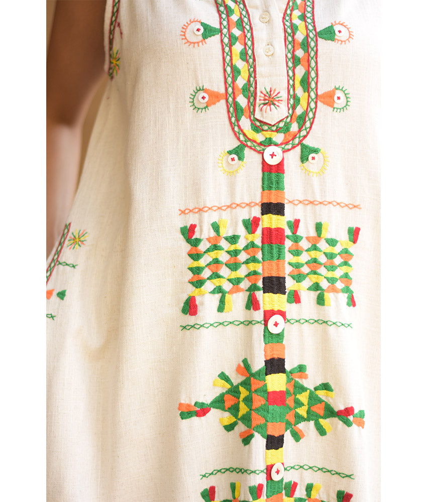 Off white Siwa Heavily Embroidered Linen Dress with Hoodie handmade in Egypt & available at Jozee Boutique.