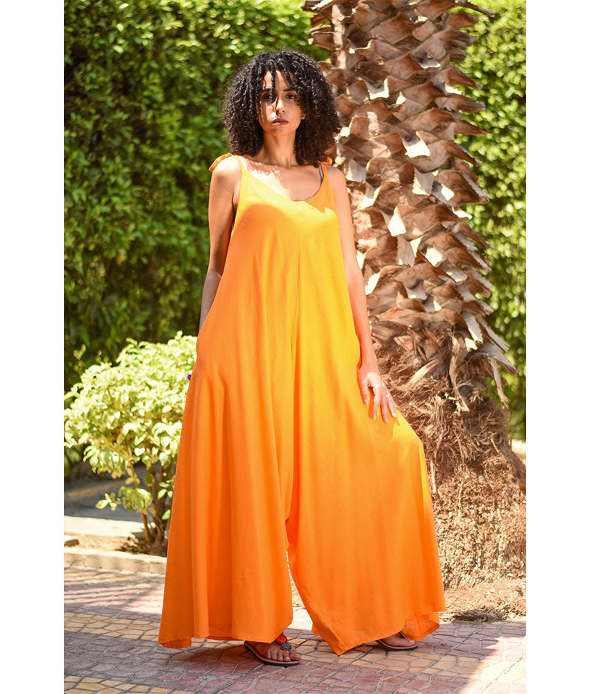 Orange Flowy Jumpsuit/Dress handmade in Egypt & available at Jozee Boutique.