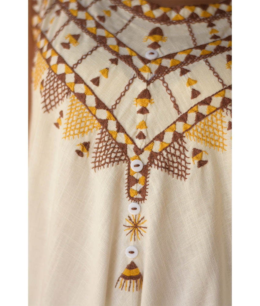 White Siwa Embroidered Linen Flowy Jumpsuit/Dress handmade in Egypt & available at Jozee Boutique.