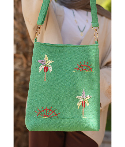 Mint green Embroidered Palm Linen Cross Bag handmade in Egypt & available at Jozee Boutique.handmade in Egypt & available at Jozee Boutique.