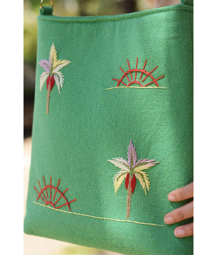 Mint green Embroidered Palm Linen Cross Bag handmade in Egypt & available at Jozee Boutique.handmade in Egypt & available at Jozee Boutique.