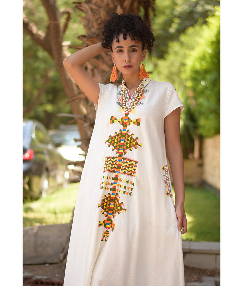 White Siwa Embroidered Linen Japanese Dress handmade in Egypt & available at Jozee Boutique.