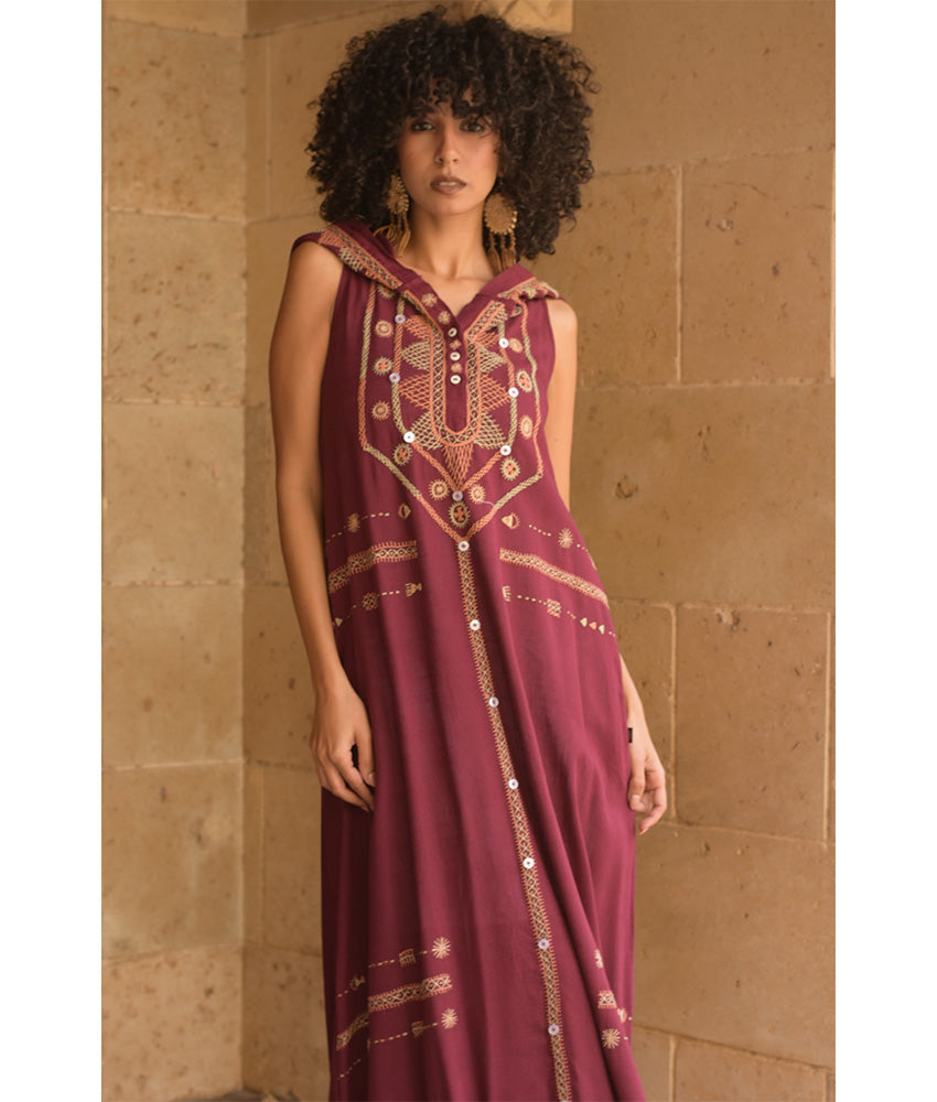 Burgundy Siwa Heavily Embroidered Linen Dress with Hoodie handmade in Egypt & available at Jozee Boutique.
