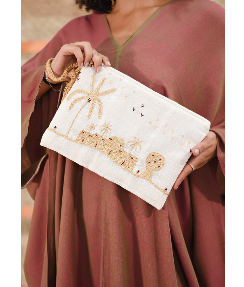Off White Embroidered Clutch handmade in Egypt & available at Jozee Boutique.