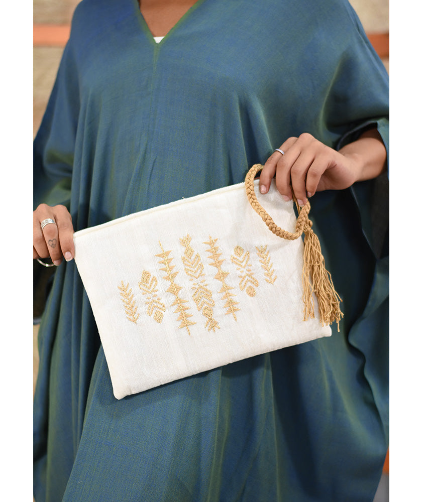 Off White Embroidered Clutch handmade in Egypt & available at Jozee Boutique.