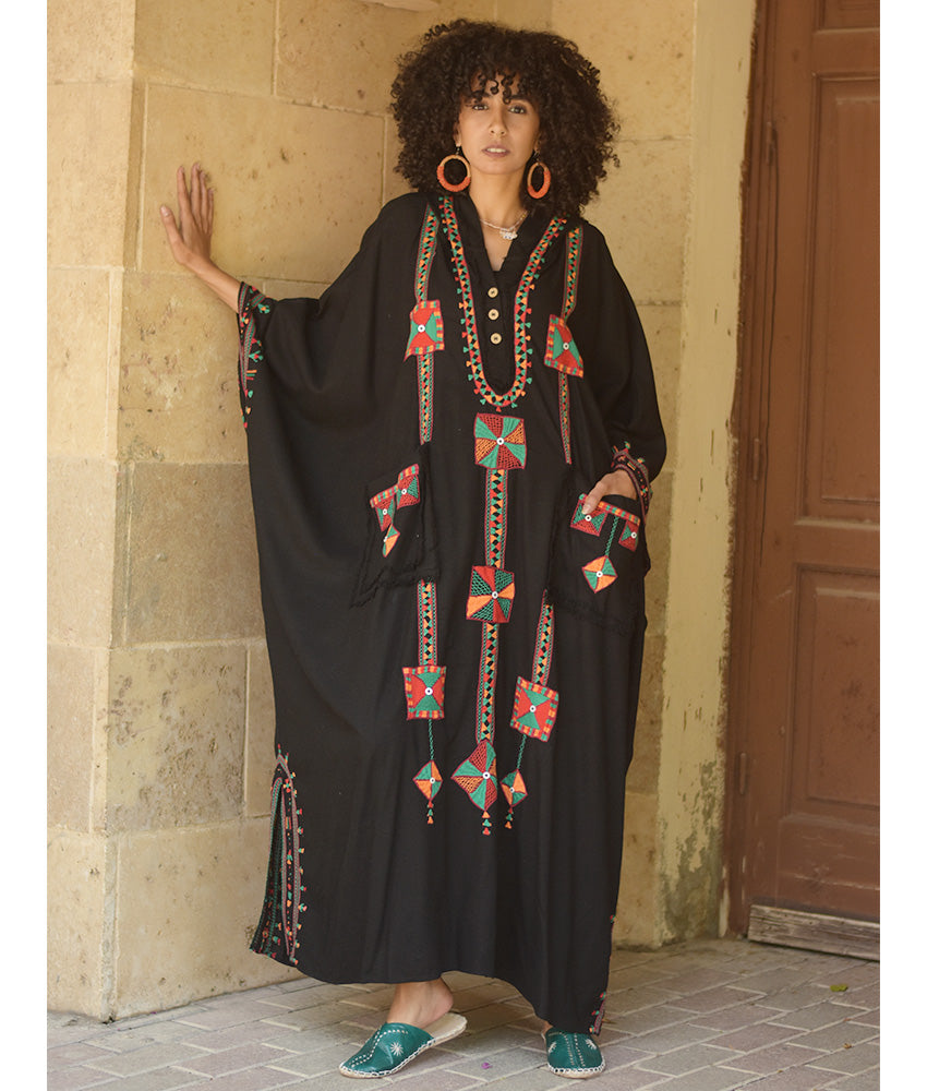 Black Siwa Embroidered Linen Kaftan with Hoodie handmade in Egypt & available at Jozee Boutique.