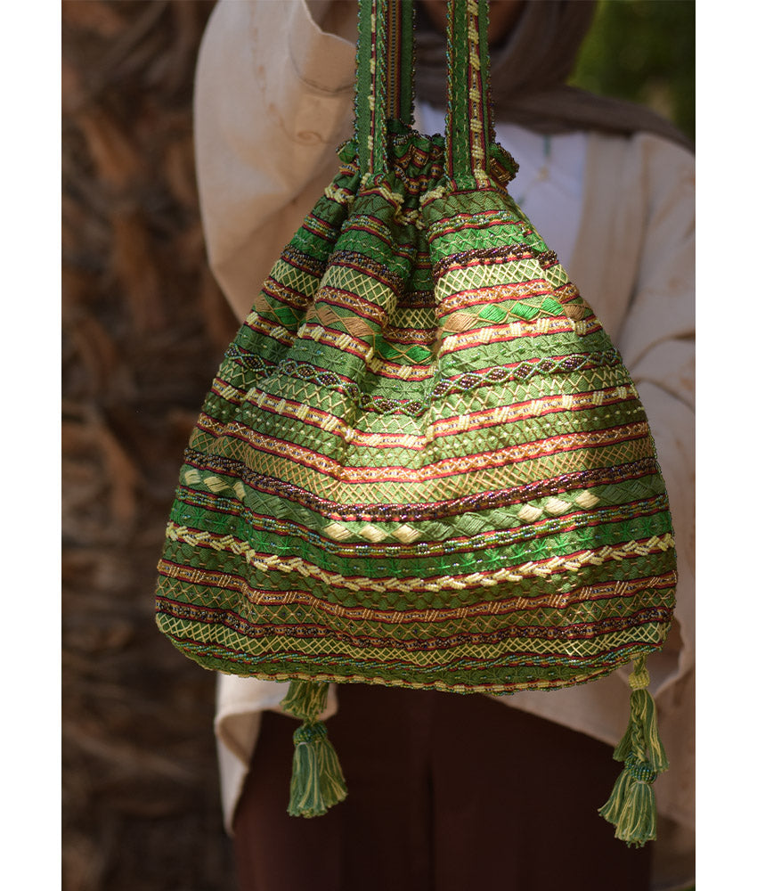Green Beaded Saint Catherine handbag handmade in Egypt & available in Jozee boutique