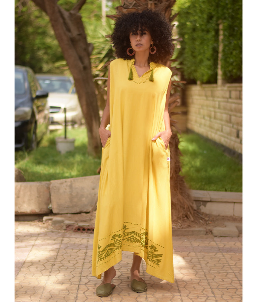 Yellow Linen Dress with Ancient Egyptian Lotus Embroidery handmade in Egypt & available at Jozee Boutique.