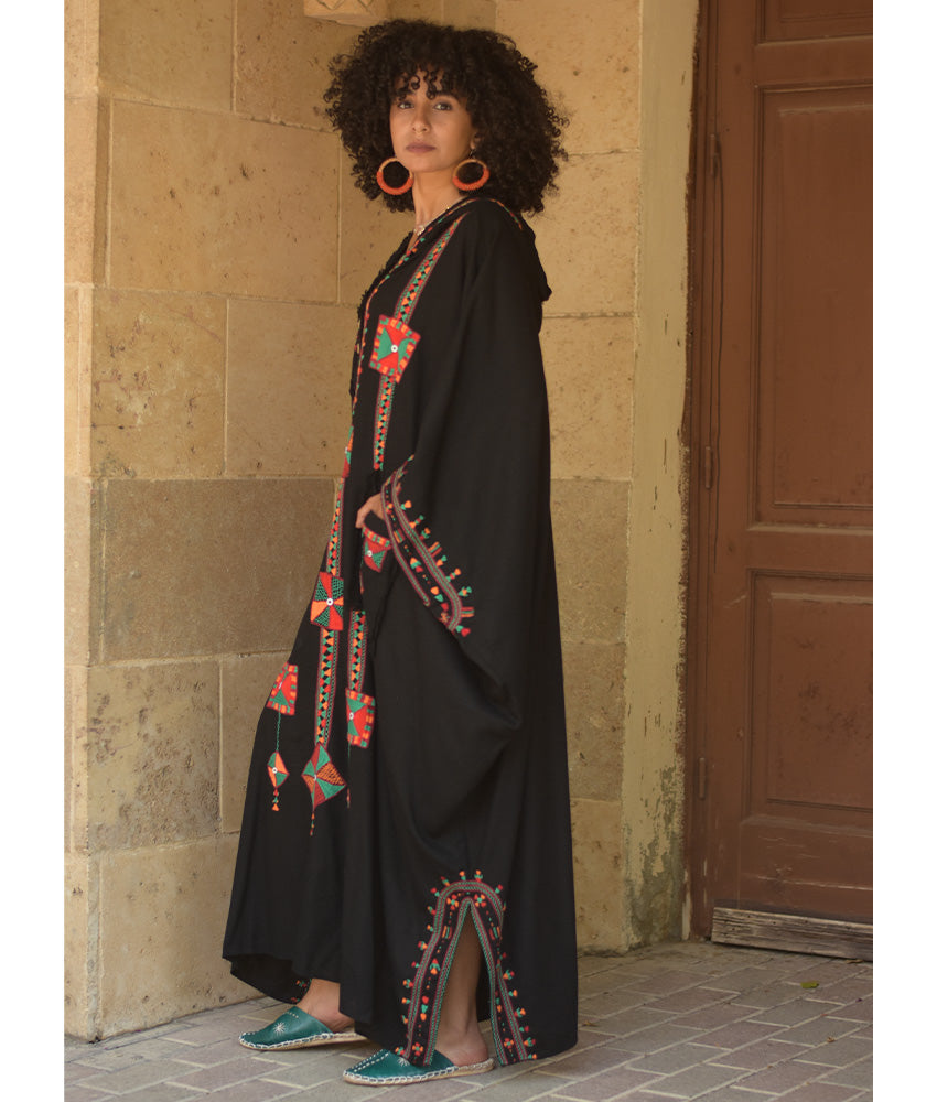 Black Siwa Embroidered Linen Kaftan with Hoodie handmade in Egypt & available at Jozee Boutique.