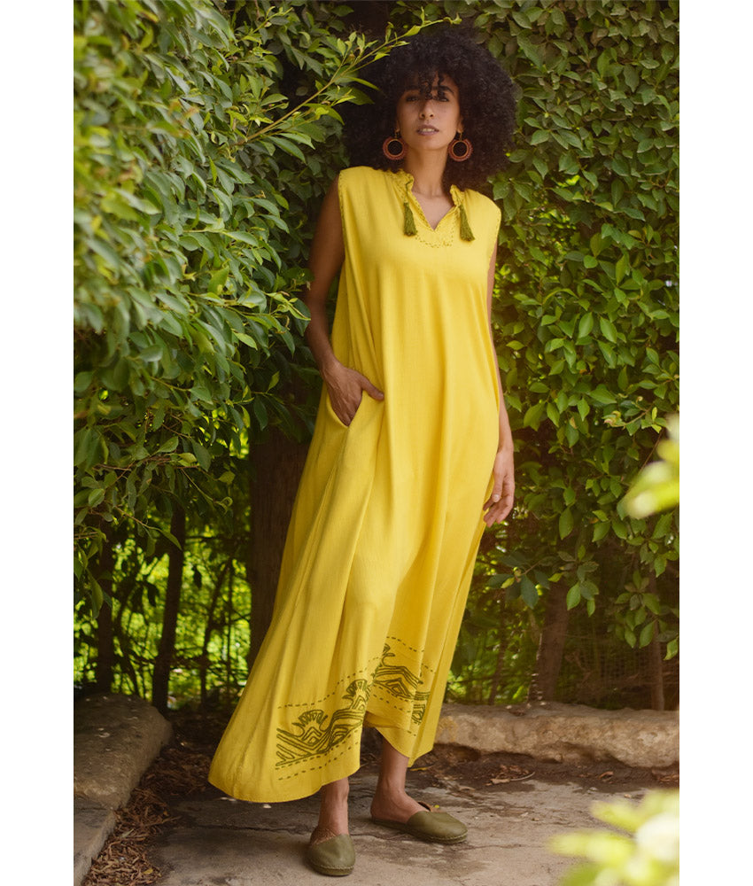 Yellow Linen Dress with Ancient Egyptian Lotus Embroidery handmade in Egypt & available at Jozee Boutique.