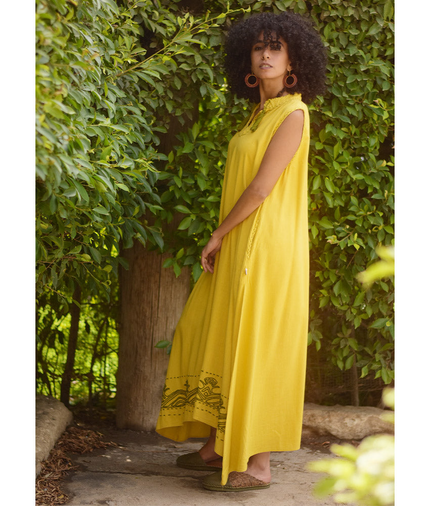 Yellow Linen Dress with Ancient Egyptian Lotus Embroidery handmade in Egypt & available at Jozee Boutique.