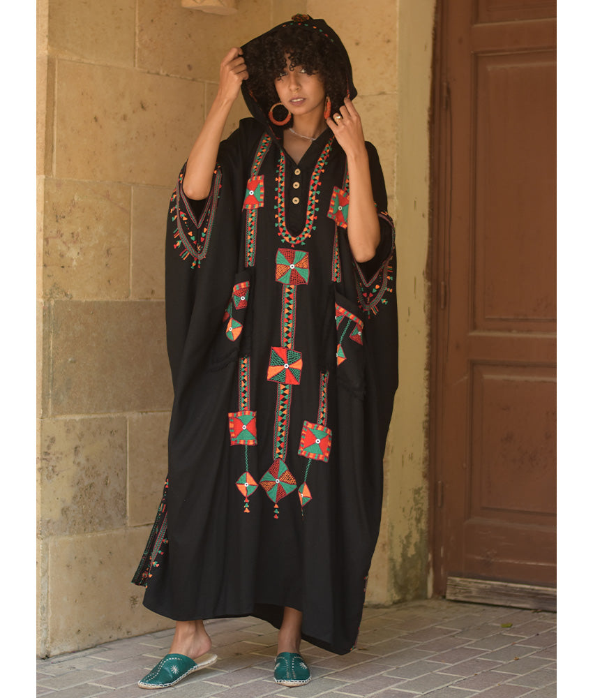Black Siwa Embroidered Linen Kaftan with Hoodie handmade in Egypt & available at Jozee Boutique.