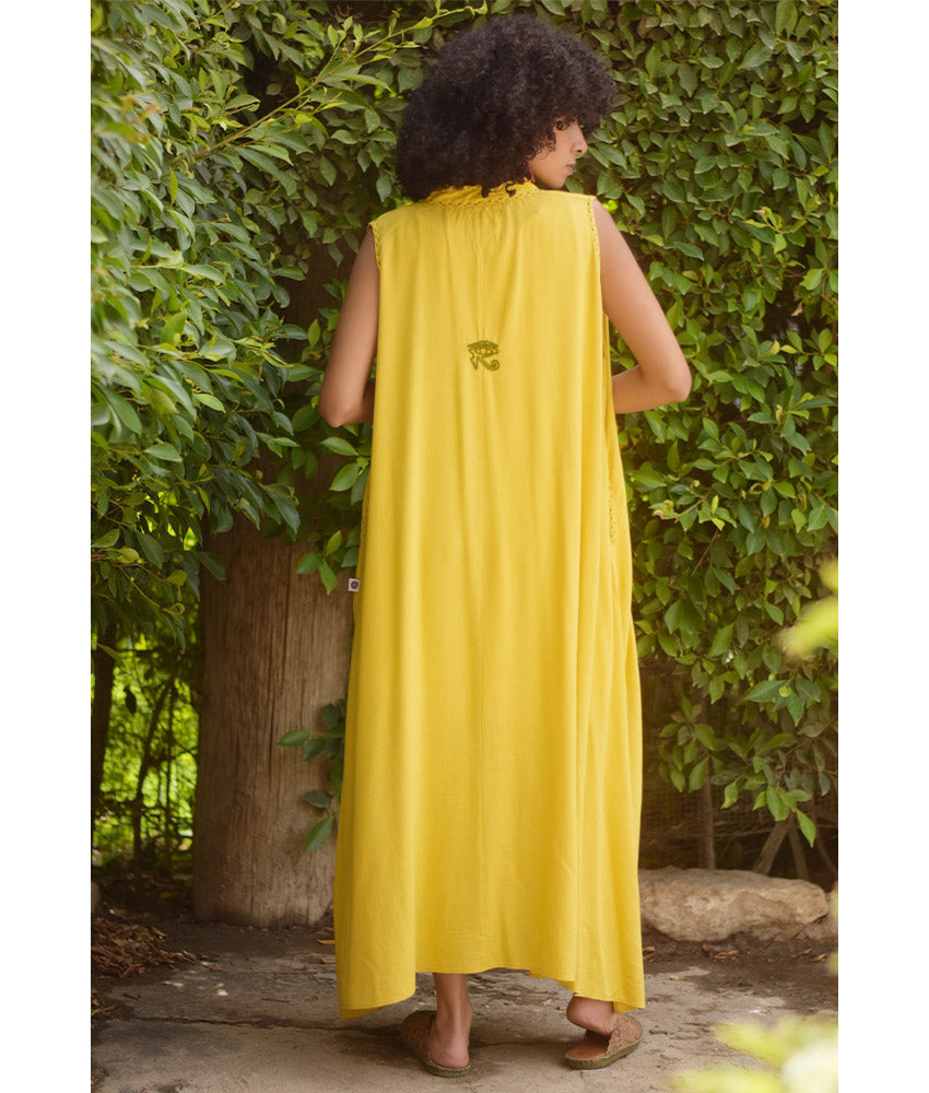 Yellow Linen Dress with Ancient Egyptian Lotus Embroidery handmade in Egypt & available at Jozee Boutique.
