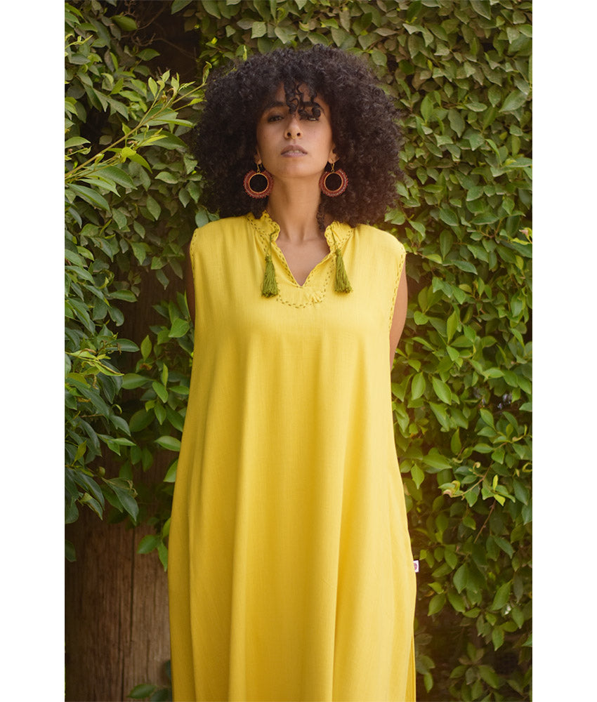Yellow Linen Dress with Ancient Egyptian Lotus Embroidery handmade in Egypt & available at Jozee Boutique.