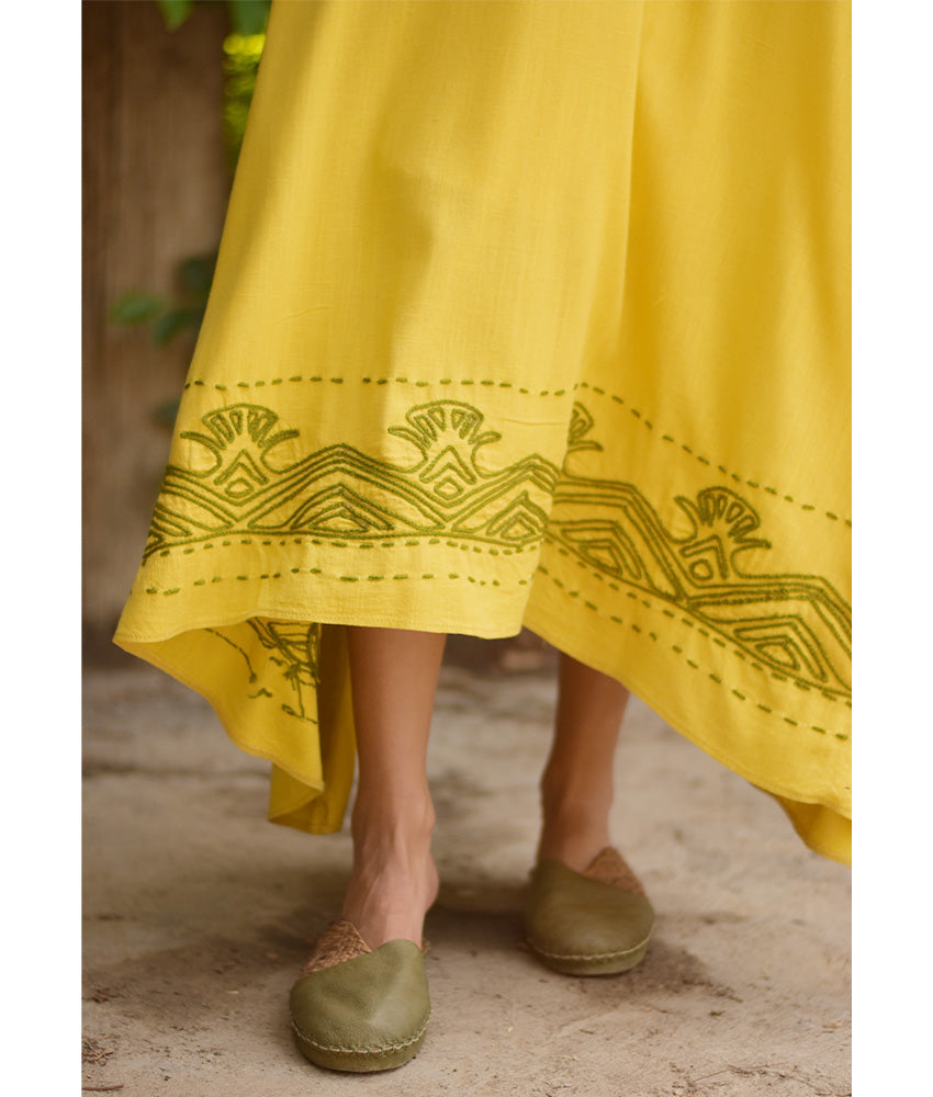 Yellow Linen Dress with Ancient Egyptian Lotus Embroidery handmade in Egypt & available at Jozee Boutique.