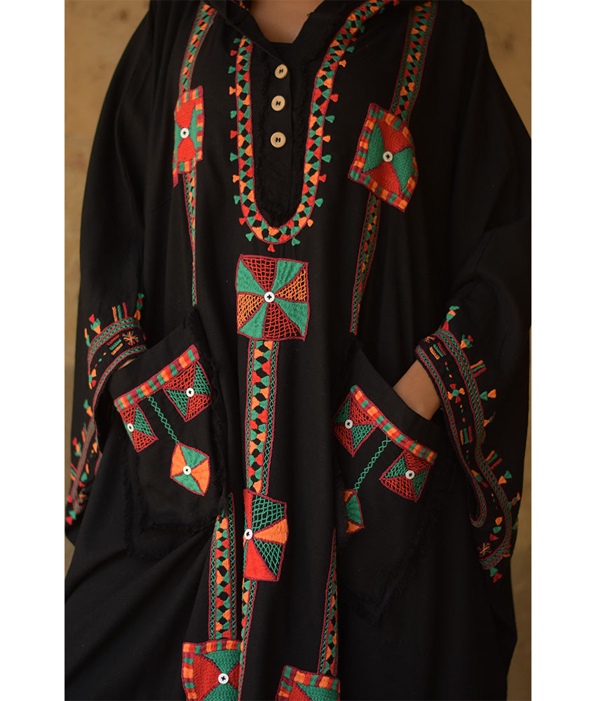 Black Siwa Embroidered Linen Kaftan with Hoodie handmade in Egypt & available at Jozee Boutique.