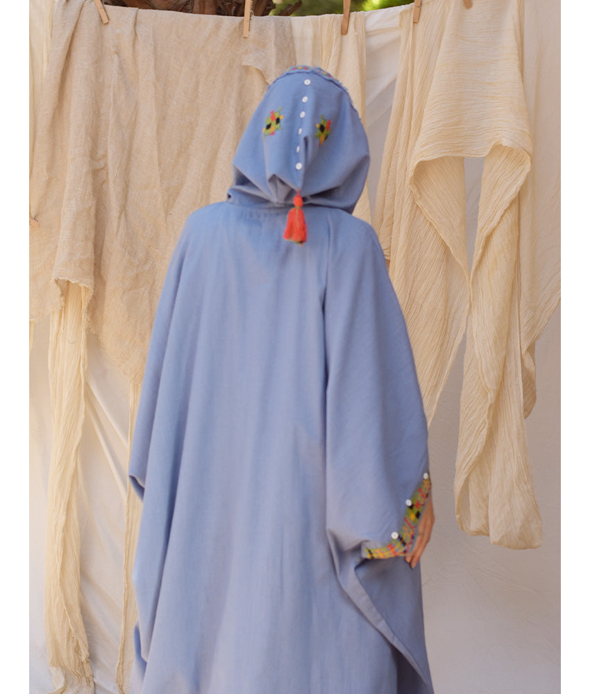 Denim blue Siwa Embroidered Linen Kaftan with Hoodie handmade in Egypt & available at Jozee Boutique.