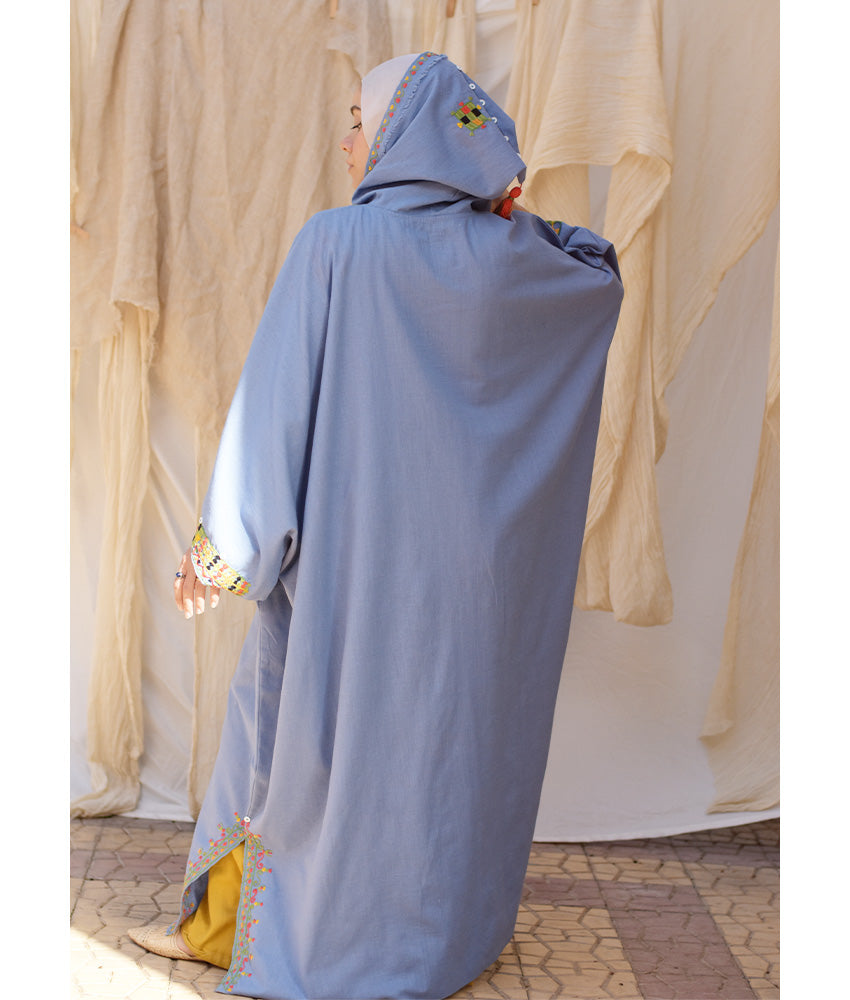 Denim blue Siwa Embroidered Linen Kaftan with Hoodie handmade in Egypt & available at Jozee Boutique.