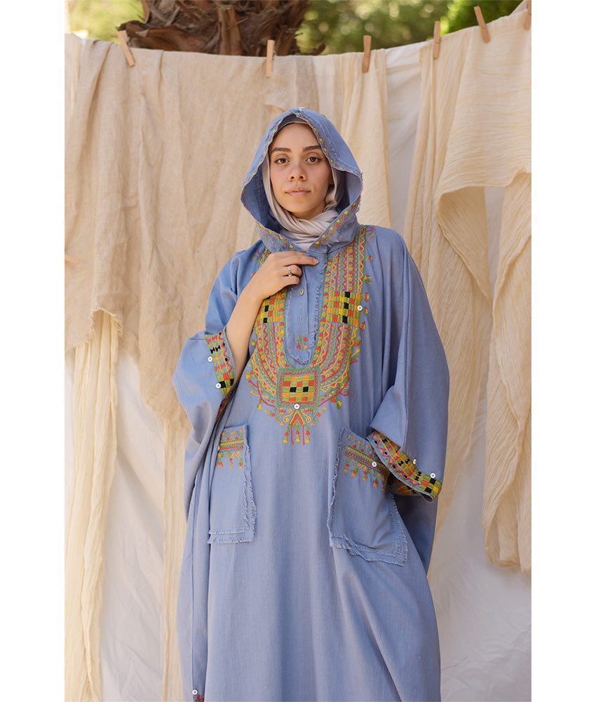 Denim blue Siwa Embroidered Linen Kaftan with Hoodie handmade in Egypt & available at Jozee Boutique.