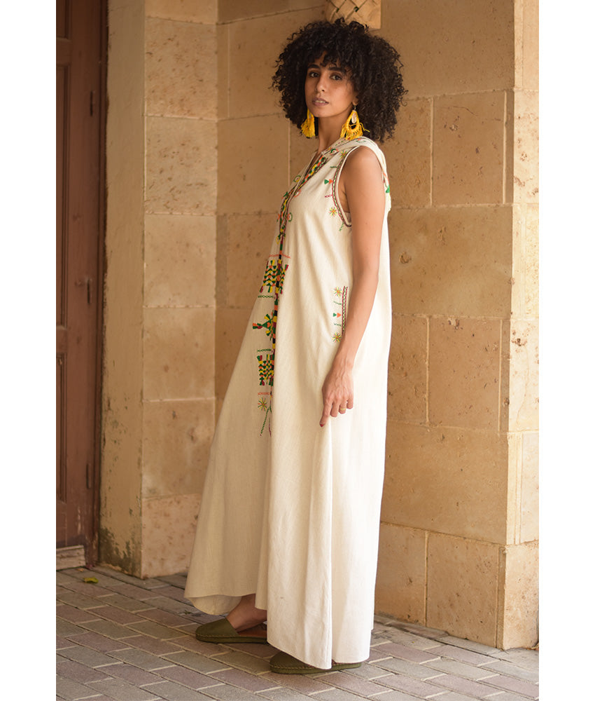 Off white Siwa Heavily Embroidered Linen Dress with Hoodie handmade in Egypt & available at Jozee Boutique.