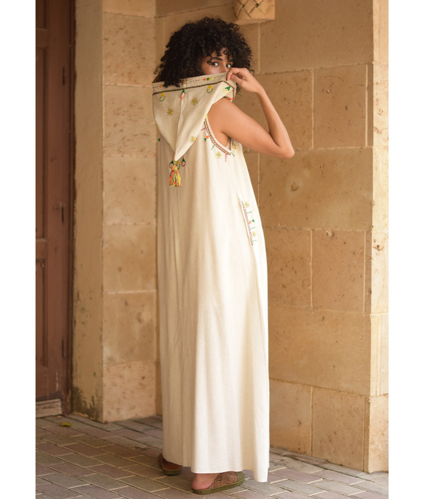 Off white Siwa Heavily Embroidered Linen Dress with Hoodie handmade in Egypt & available at Jozee Boutique.