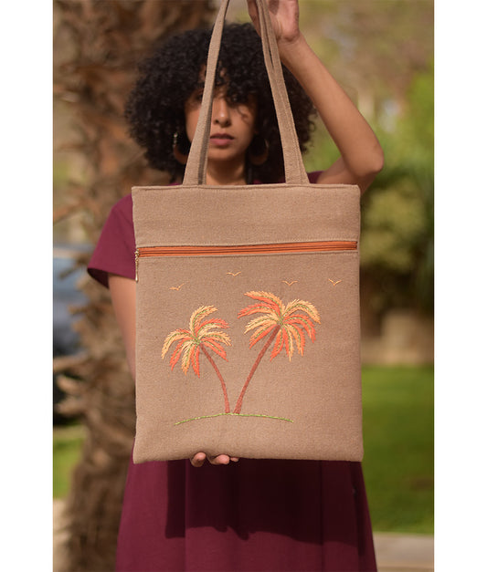 Dark Beige Embroidered Palm Linen Tote Bag handmade in Egypt & available at Jozee Boutique.handmade in Egypt & available at Jozee Boutique.