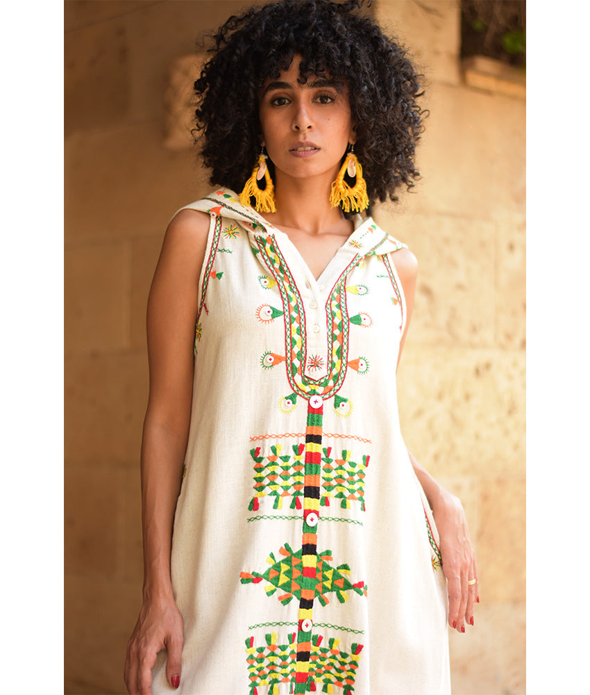 Off white Siwa Heavily Embroidered Linen Dress with Hoodie handmade in Egypt & available at Jozee Boutique.