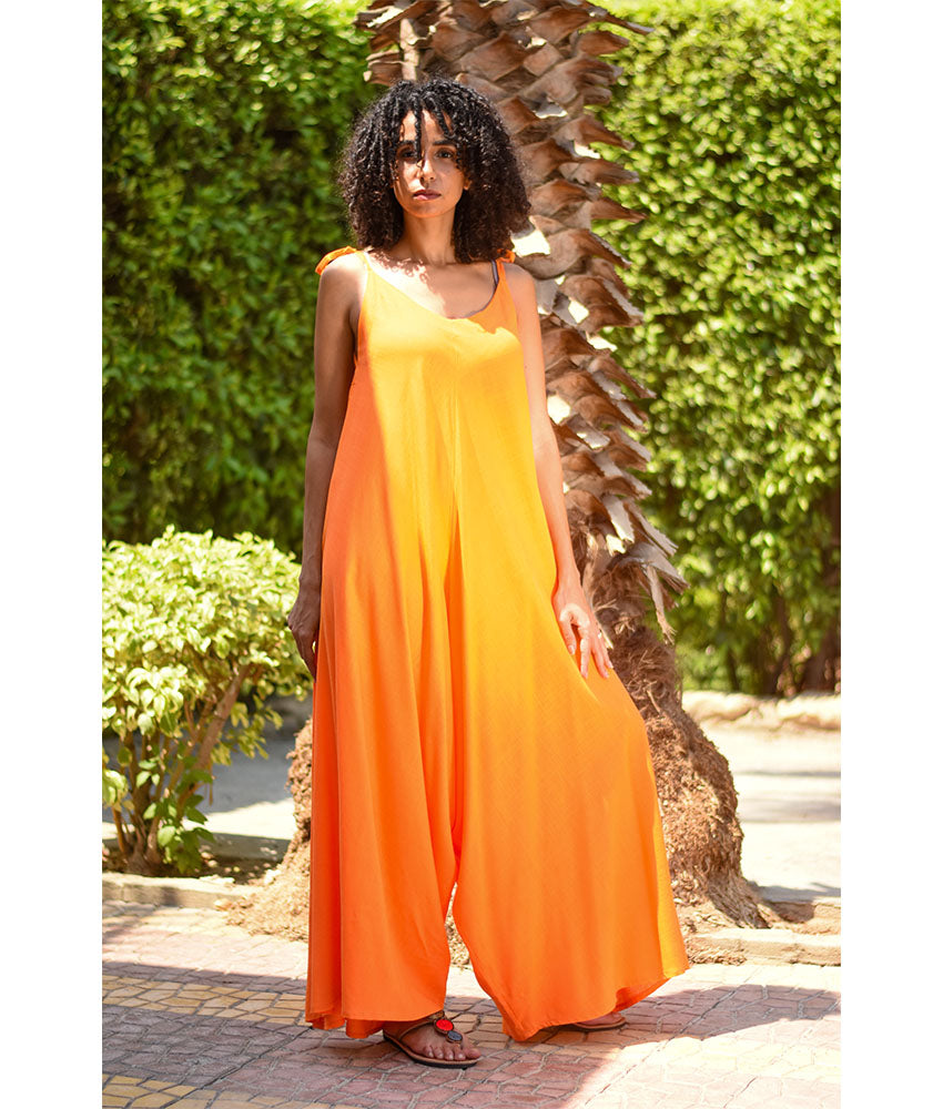 Orange Flowy Jumpsuit/Dress handmade in Egypt & available at Jozee Boutique.
