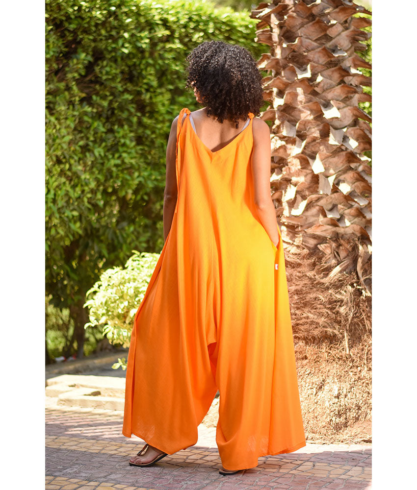 Orange Flowy Jumpsuit/Dress handmade in Egypt & available at Jozee Boutique.