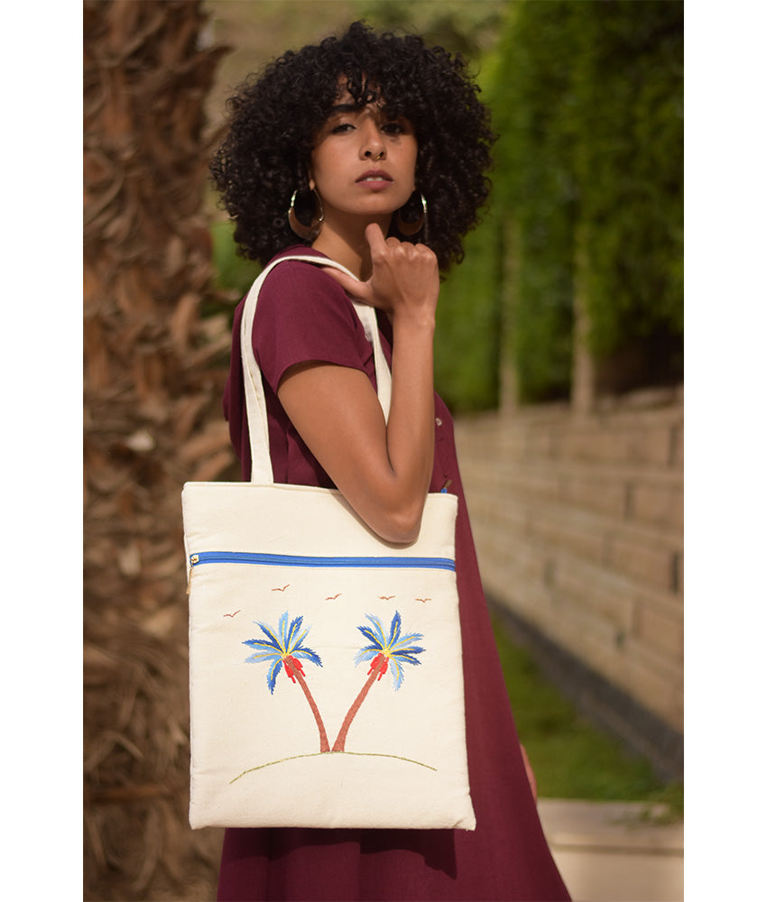 Off white Embroidered Palm Linen Tote Bag handmade in Egypt & available at Jozee Boutique.handmade in Egypt & available at Jozee Boutique.