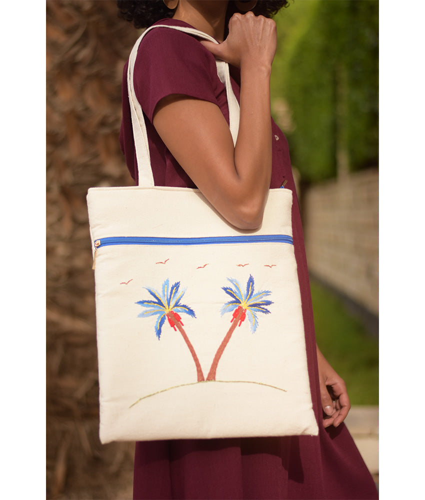 Off white Embroidered Palm Linen Tote Bag handmade in Egypt & available at Jozee Boutique.handmade in Egypt & available at Jozee Boutique.