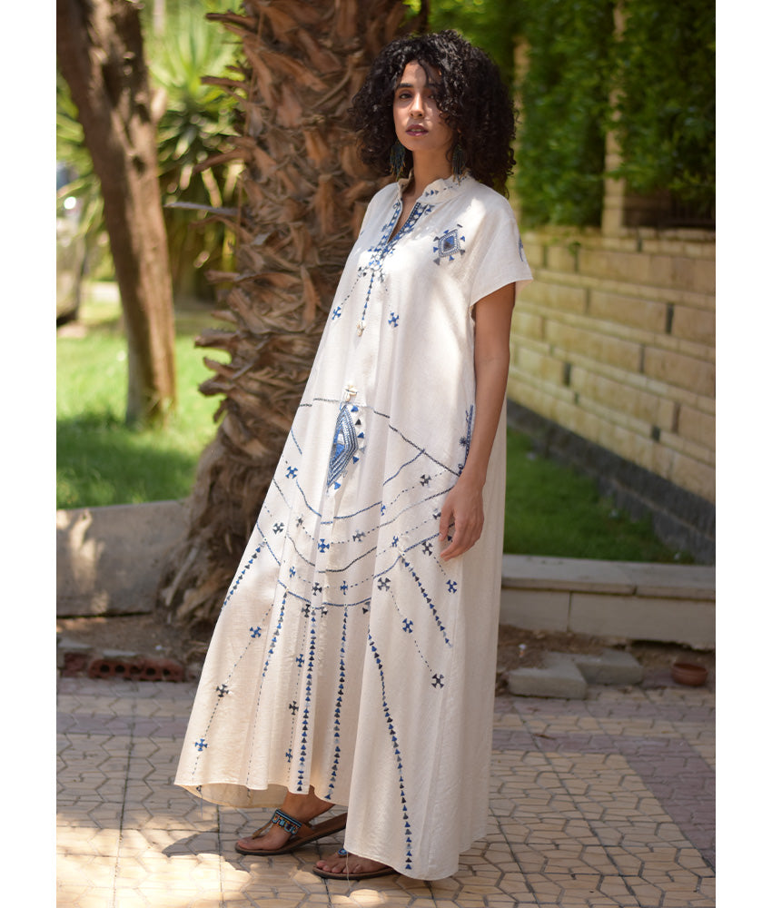 Off White Siwa Embroidered Linen Japanese Dress handmade in Egypt & available at Jozee Boutique.