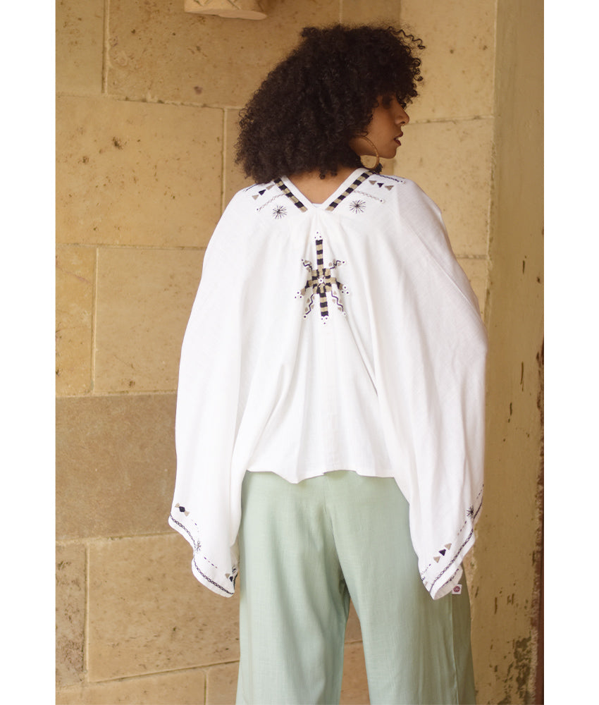 White Siwa Embroidered Linen Bolero made in Egypt & available at Jozee Boutique.