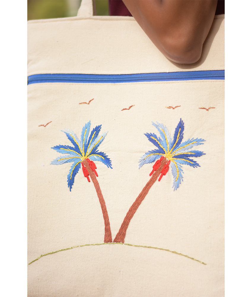 Off white Embroidered Palm Linen Tote Bag handmade in Egypt & available at Jozee Boutique.handmade in Egypt & available at Jozee Boutique.