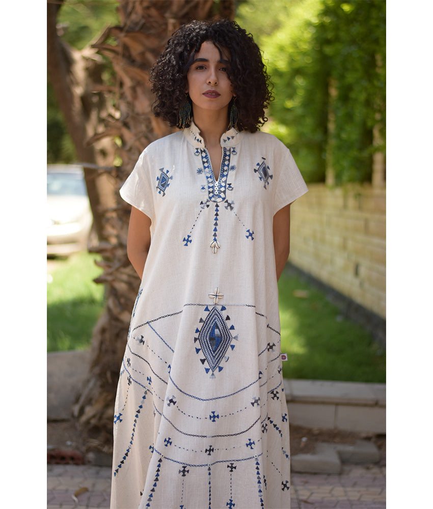 Off White Siwa Embroidered Linen Japanese Dress handmade in Egypt & available at Jozee Boutique.