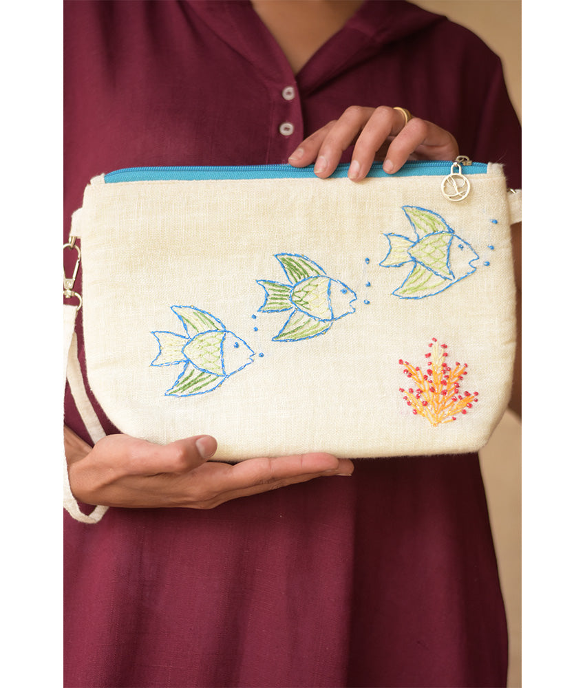 Off White Embroidered Floral Canvas Pouch handmade in Egypt & available at Jozee Boutique.handmade in Egypt & available at Jozee Boutique.