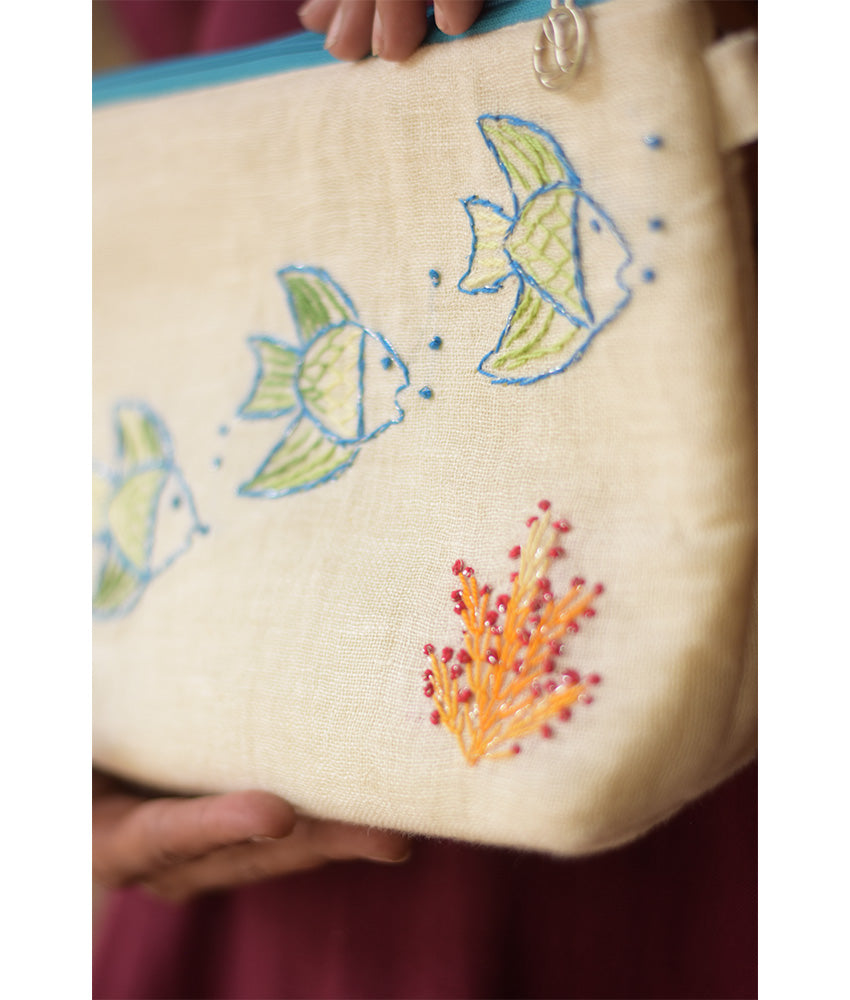 Off White Embroidered Floral Canvas Pouch handmade in Egypt & available at Jozee Boutique.handmade in Egypt & available at Jozee Boutique.