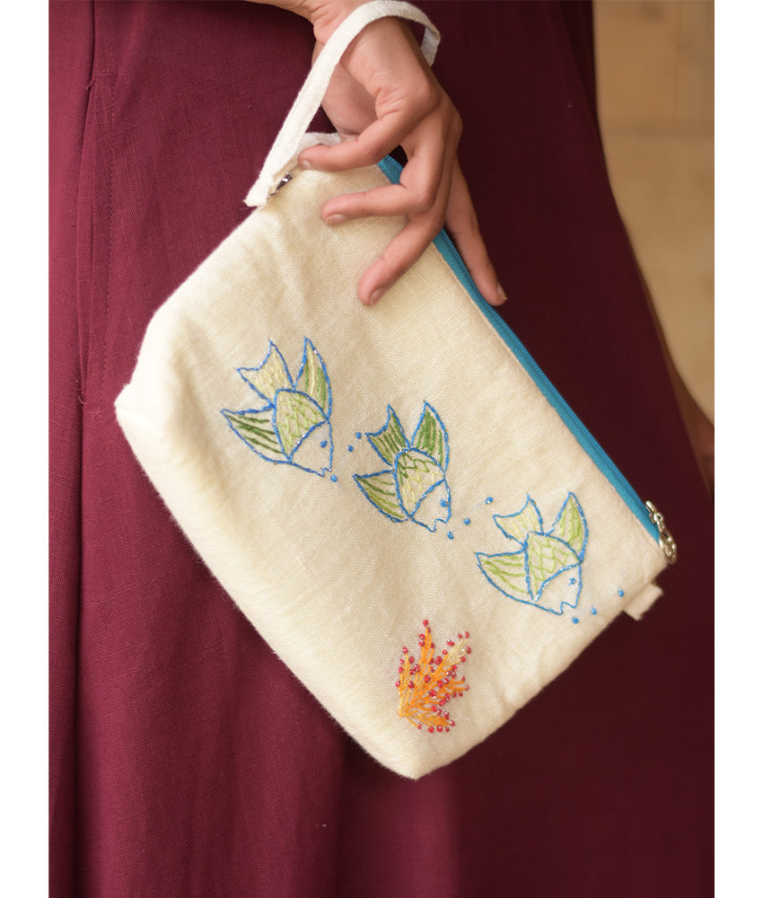 Off White Embroidered Floral Canvas Pouch handmade in Egypt & available at Jozee Boutique.handmade in Egypt & available at Jozee Boutique.