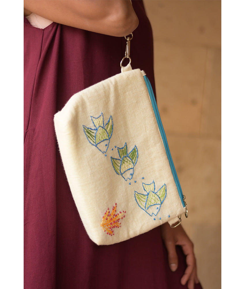 Off White Embroidered Floral Canvas Pouch handmade in Egypt & available at Jozee Boutique.handmade in Egypt & available at Jozee Boutique.