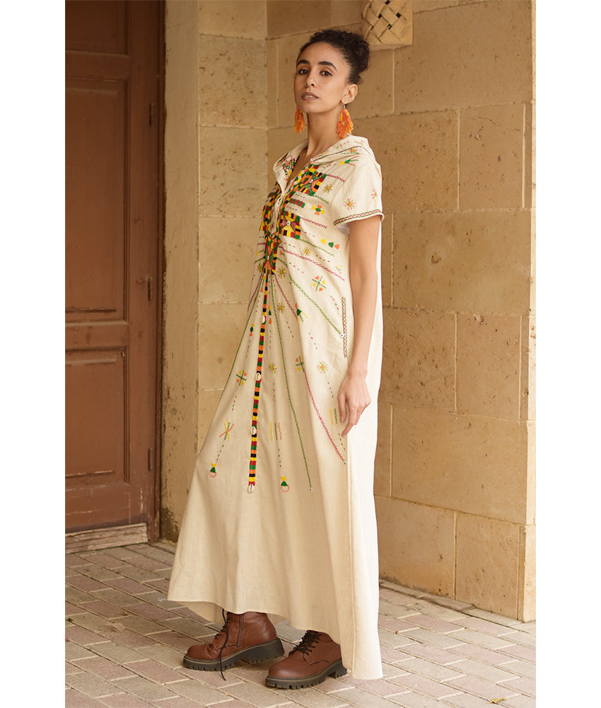 Off white Siwa Heavily Embroidered Linen Dress with Hoodie handmade in Egypt & available at Jozee Boutique.