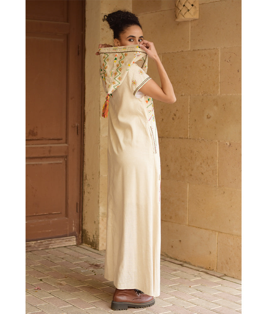 Off white Siwa Heavily Embroidered Linen Dress with Hoodie handmade in Egypt & available at Jozee Boutique.