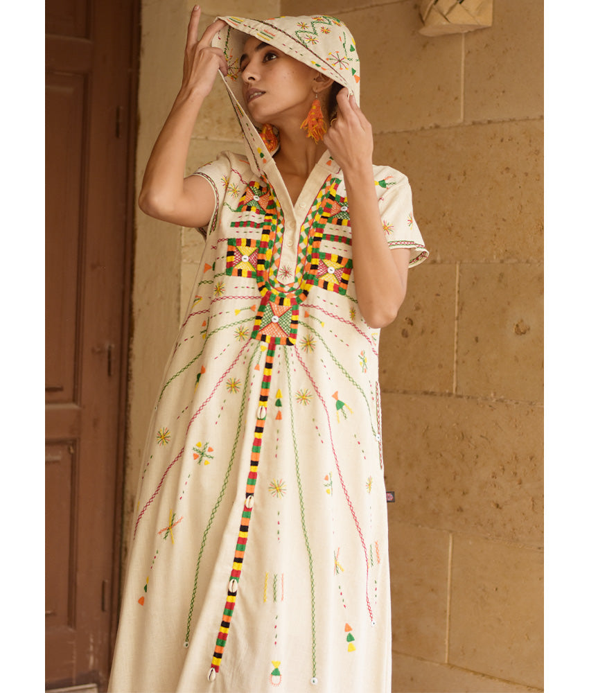 Off white Siwa Heavily Embroidered Linen Dress with Hoodie handmade in Egypt & available at Jozee Boutique.