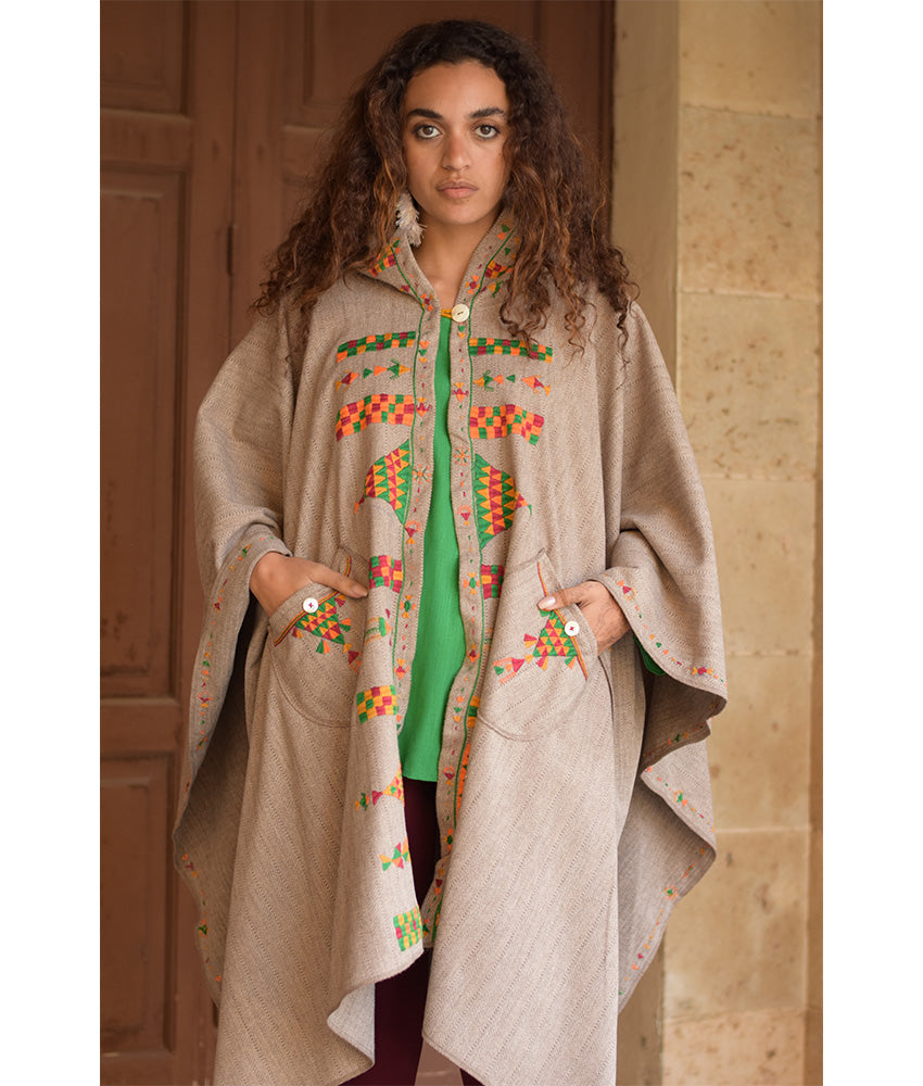 Beige Siwa Embroidered Wool Midi Cape handmade in Egypt & available at Jozee Boutique.