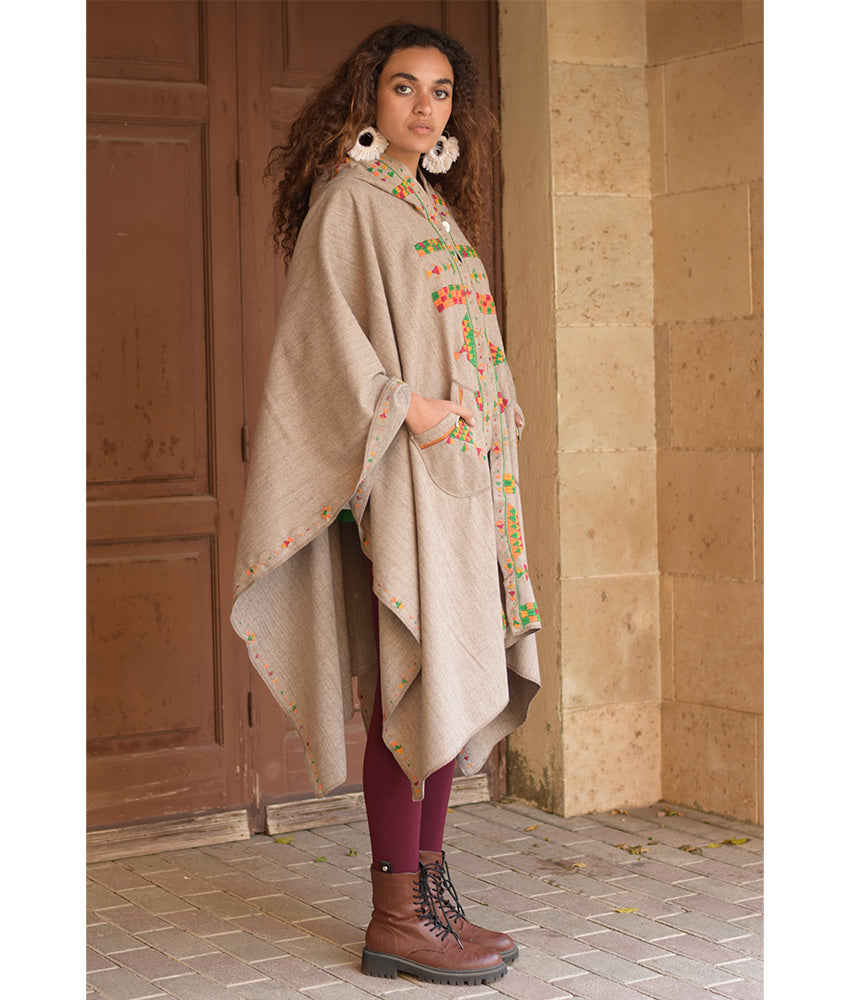 Beige Siwa Embroidered Wool Midi Cape handmade in Egypt & available at Jozee Boutique.