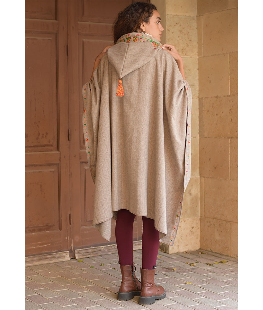 Beige Siwa Embroidered Wool Midi Cape handmade in Egypt & available at Jozee Boutique.