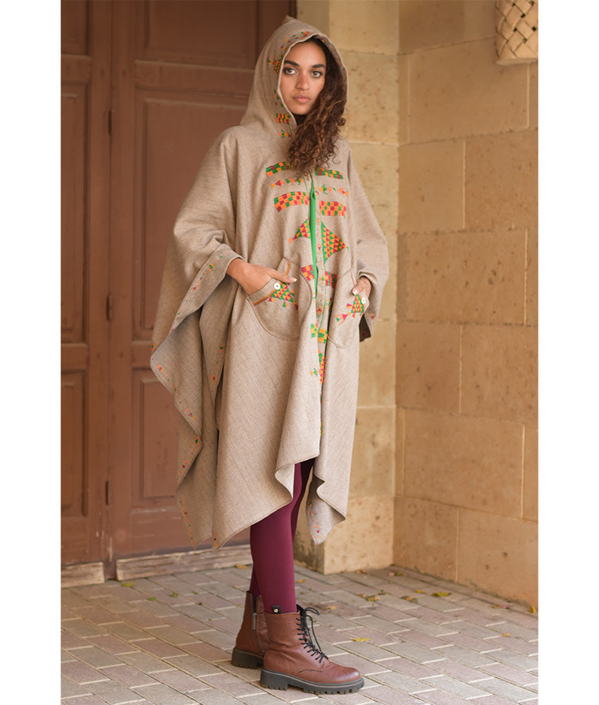 Beige Siwa Embroidered Wool Midi Cape handmade in Egypt & available at Jozee Boutique.