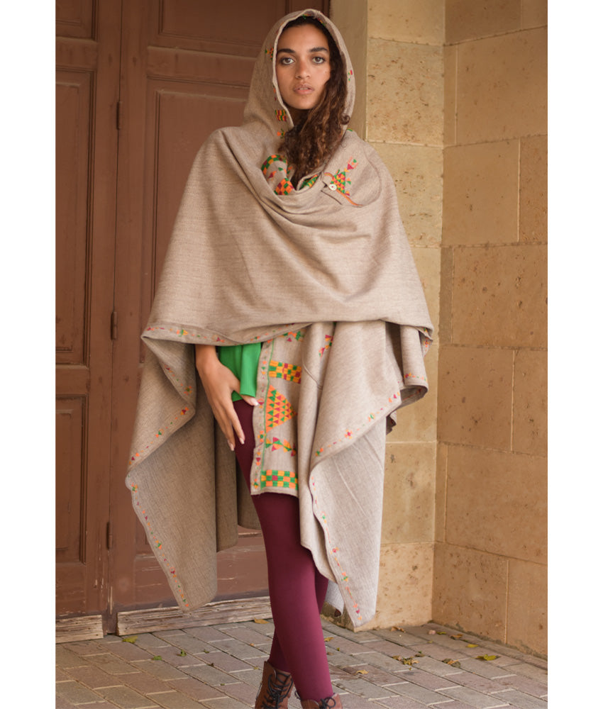 Beige Siwa Embroidered Wool Midi Cape handmade in Egypt & available at Jozee Boutique.