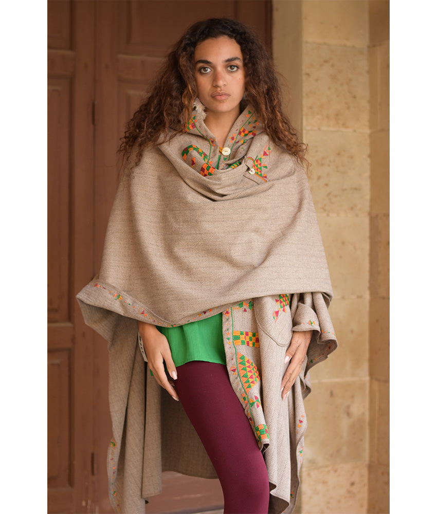 Beige Siwa Embroidered Wool Midi Cape handmade in Egypt & available at Jozee Boutique.