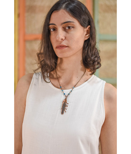 Copper Pigeon Feather Necklace with Blue Apatite handmade in Egypt & available in Jozee Boutique
