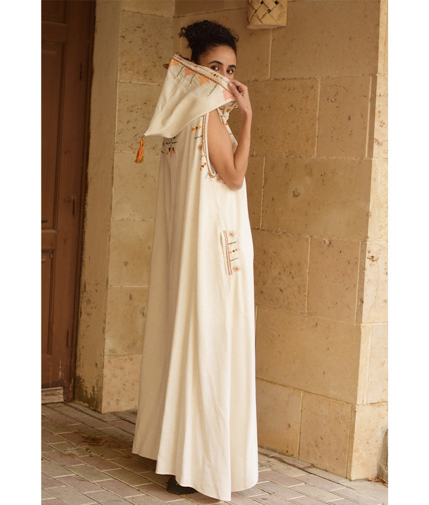 Off white Siwa Heavily Embroidered Linen Dress with Hoodie handmade in Egypt & available at Jozee Boutique.